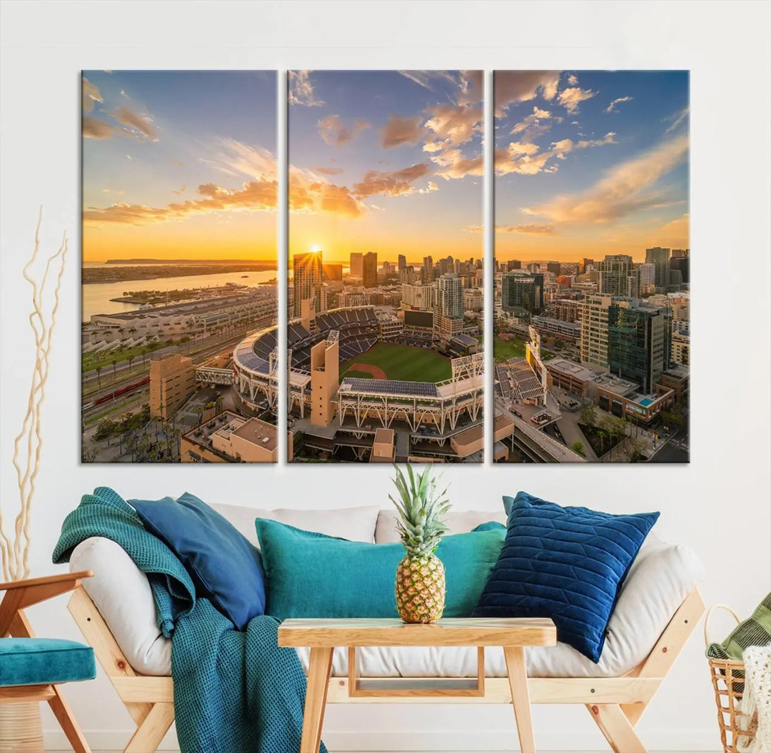 This Petco Park Sunset Triple Canvas Wall Art beautifully captures a vibrant San Diego cityscape at sunset, showcasing the iconic glow of Petco Park and high-rise buildings against a colorful sky.