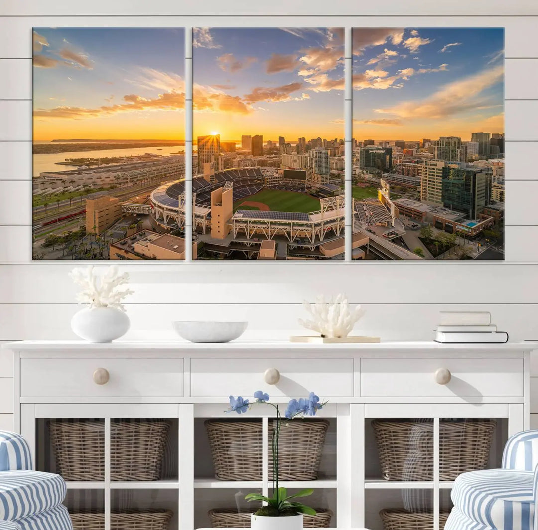 This Petco Park Sunset Triple Canvas Wall Art beautifully captures a vibrant San Diego cityscape at sunset, showcasing the iconic glow of Petco Park and high-rise buildings against a colorful sky.