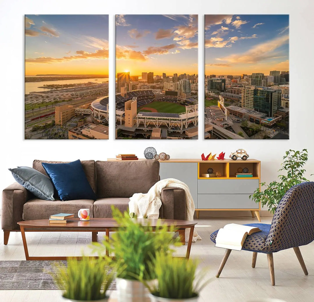 This Petco Park Sunset Triple Canvas Wall Art beautifully captures a vibrant San Diego cityscape at sunset, showcasing the iconic glow of Petco Park and high-rise buildings against a colorful sky.