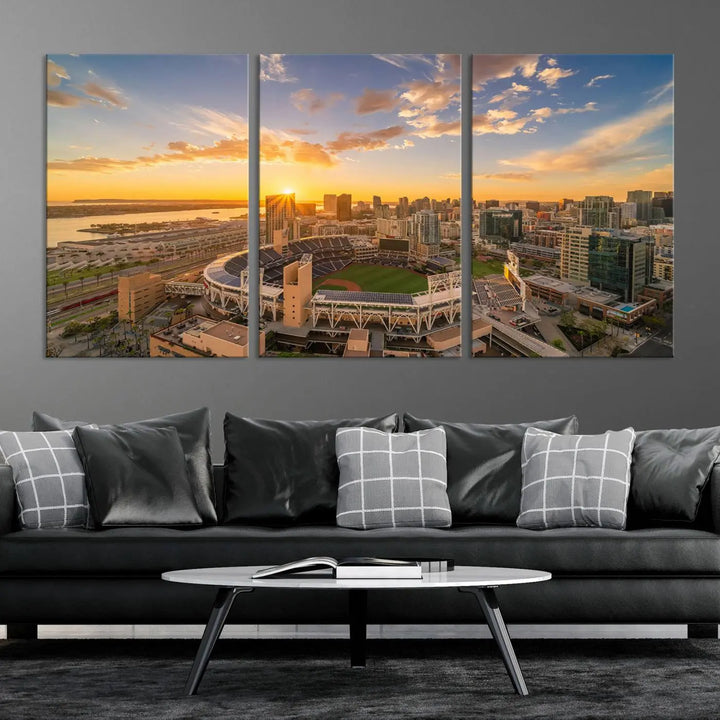 This Petco Park Sunset Triple Canvas Wall Art beautifully captures a vibrant San Diego cityscape at sunset, showcasing the iconic glow of Petco Park and high-rise buildings against a colorful sky.