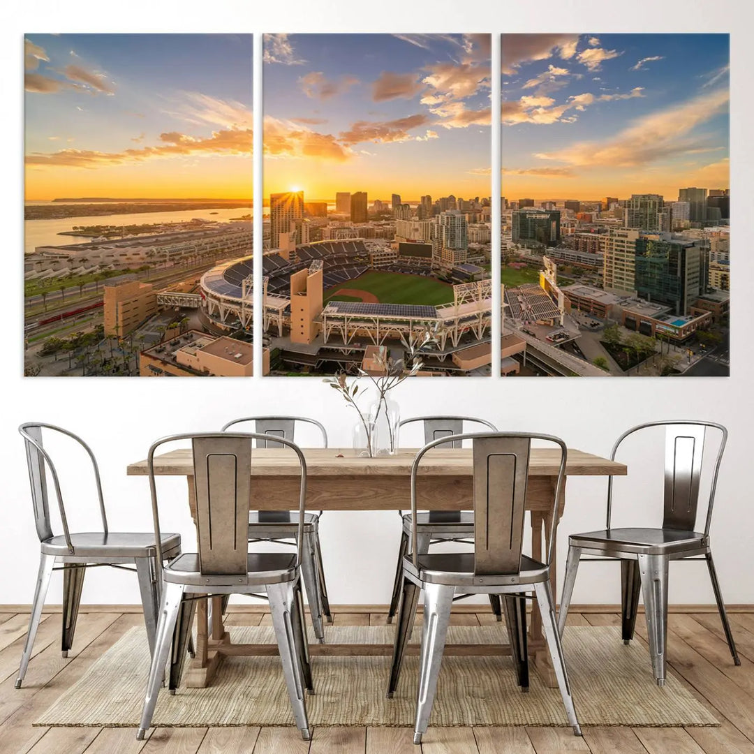 This Petco Park Sunset Triple Canvas Wall Art beautifully captures a vibrant San Diego cityscape at sunset, showcasing the iconic glow of Petco Park and high-rise buildings against a colorful sky.