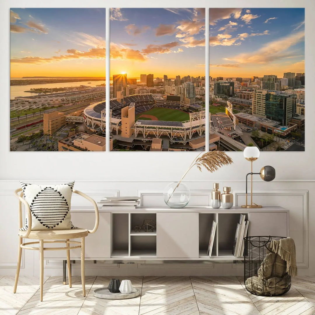 This Petco Park Sunset Triple Canvas Wall Art beautifully captures a vibrant San Diego cityscape at sunset, showcasing the iconic glow of Petco Park and high-rise buildings against a colorful sky.