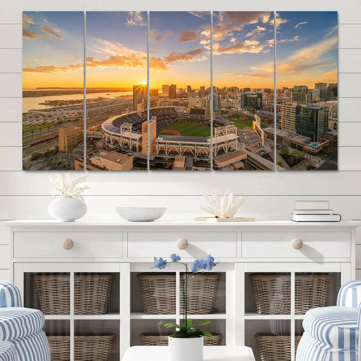 This Petco Park Sunset Triple Canvas Wall Art beautifully captures a vibrant San Diego cityscape at sunset, showcasing the iconic glow of Petco Park and high-rise buildings against a colorful sky.