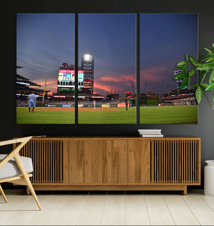 The Philadelphia Phillies Baseball Team Print, featuring the Citizens Bank Park Stadium at sunset, adorns the wall. Its gallery-quality canvas finish brings a touch of elegance to the space.