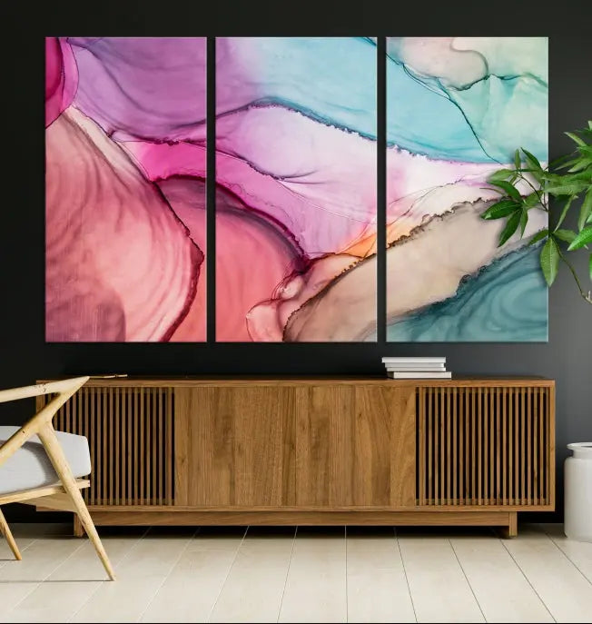 The Pink Abstract Marble Wall Art Canvas Print, a five-panel masterpiece on museum-quality canvas, showcases pink, blue, and beige waves. This gallery-wrapped artwork includes a UV-protective coating to ensure lasting vibrancy.