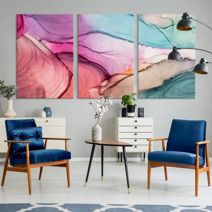 The Pink Abstract Marble Wall Art Canvas Print, a five-panel masterpiece on museum-quality canvas, showcases pink, blue, and beige waves. This gallery-wrapped artwork includes a UV-protective coating to ensure lasting vibrancy.