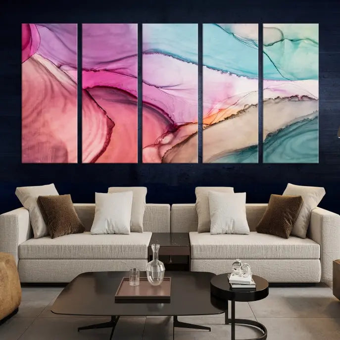 The "Pink Marble Fluid Effect Wall Art Abstract Canvas Wall Art Print" features abstract pink and blue watercolors. This piece is divided into five panels and crafted on museum-quality polycotton canvas with a UV-protective coating to ensure lasting beauty.