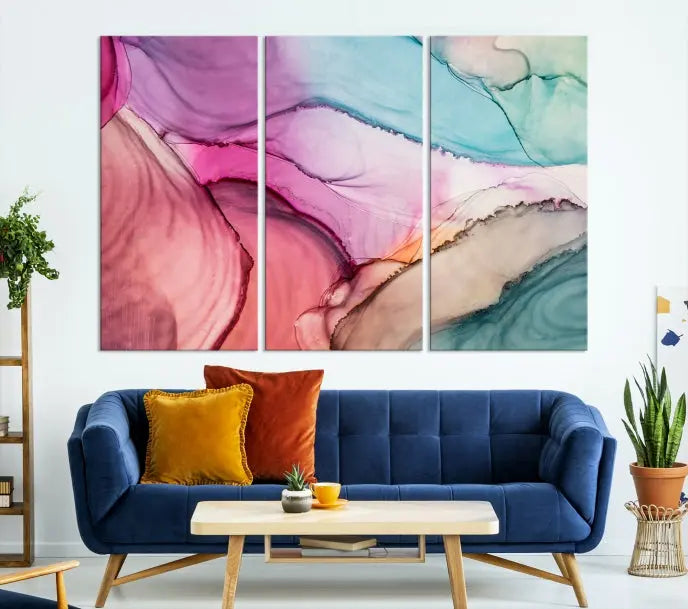 The "Pink Marble Fluid Effect Wall Art Abstract Canvas Wall Art Print" features abstract pink and blue watercolors. This piece is divided into five panels and crafted on museum-quality polycotton canvas with a UV-protective coating to ensure lasting beauty.