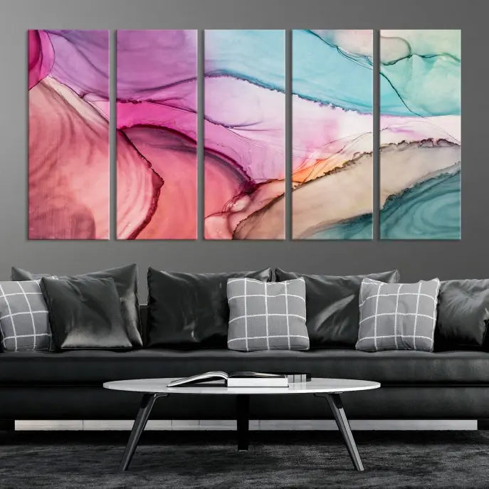 The "Pink Marble Fluid Effect Wall Art Abstract Canvas Wall Art Print" features abstract pink and blue watercolors. This piece is divided into five panels and crafted on museum-quality polycotton canvas with a UV-protective coating to ensure lasting beauty.