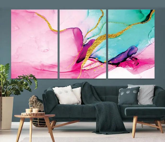 The Pink and Gold Marble Fluid Effect Wall Art Abstract Canvas Wall Art Print embellishes the space with its stunning design. Created on museum-quality canvas, this gallery-wrapped piece includes a UV-protective coating to maintain its vivid colors.