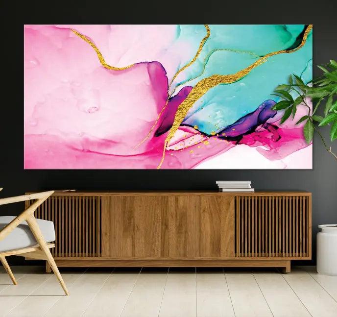 The Pink and Gold Marble Fluid Effect Wall Art Abstract Canvas Wall Art Print embellishes the space with its stunning design. Created on museum-quality canvas, this gallery-wrapped piece includes a UV-protective coating to maintain its vivid colors.