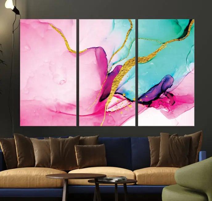 The Pink and Gold Marble Fluid Effect Wall Art Abstract Canvas Wall Art Print embellishes the space with its stunning design. Created on museum-quality canvas, this gallery-wrapped piece includes a UV-protective coating to maintain its vivid colors.