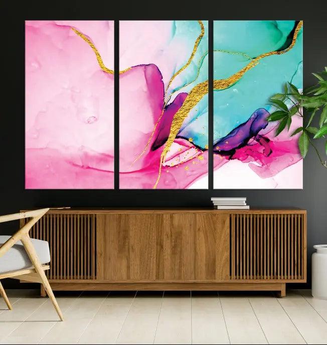 The Pink and Gold Marble Fluid Effect Wall Art Abstract Canvas Wall Art Print embellishes the space with its stunning design. Created on museum-quality canvas, this gallery-wrapped piece includes a UV-protective coating to maintain its vivid colors.