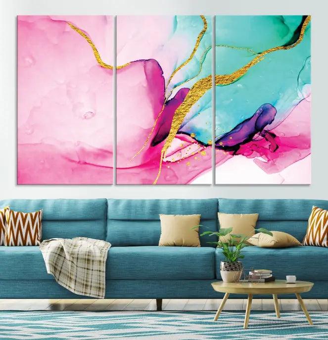 The Pink and Gold Marble Fluid Effect Wall Art Abstract Canvas Wall Art Print embellishes the space with its stunning design. Created on museum-quality canvas, this gallery-wrapped piece includes a UV-protective coating to maintain its vivid colors.