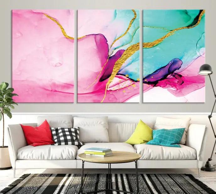 The Pink and Gold Marble Fluid Effect Wall Art Abstract Canvas Wall Art Print embellishes the space with its stunning design. Created on museum-quality canvas, this gallery-wrapped piece includes a UV-protective coating to maintain its vivid colors.