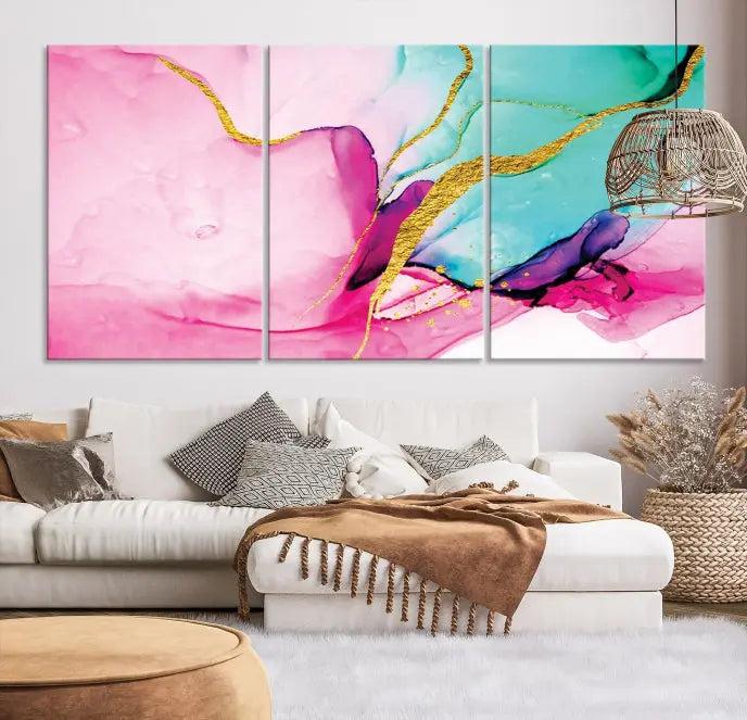 The Pink and Gold Marble Fluid Effect Wall Art Abstract Canvas Wall Art Print embellishes the space with its stunning design. Created on museum-quality canvas, this gallery-wrapped piece includes a UV-protective coating to maintain its vivid colors.