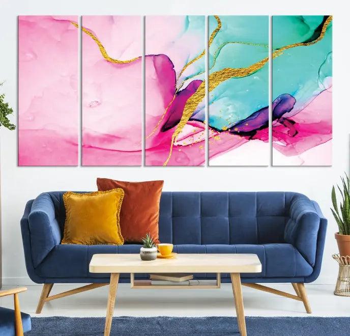 The Pink and Gold Marble Fluid Effect Wall Art Abstract Canvas Wall Art Print embellishes the space with its stunning design. Created on museum-quality canvas, this gallery-wrapped piece includes a UV-protective coating to maintain its vivid colors.