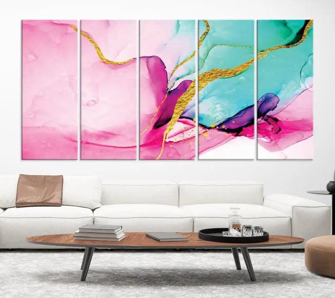 The Pink and Gold Marble Fluid Effect Wall Art Abstract Canvas Wall Art Print embellishes the space with its stunning design. Created on museum-quality canvas, this gallery-wrapped piece includes a UV-protective coating to maintain its vivid colors.