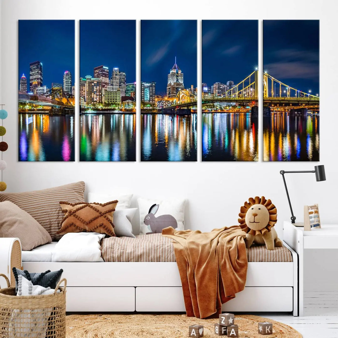 The living room features a gallery-wrapped triptych of Pittsburgh's skyline at night, reflecting on water. This Pittsburgh Skyline Canvas Wall Art is displayed above the cabinets and is printed on museum-quality canvas with a UV-protective coating to maintain its lasting vibrancy.