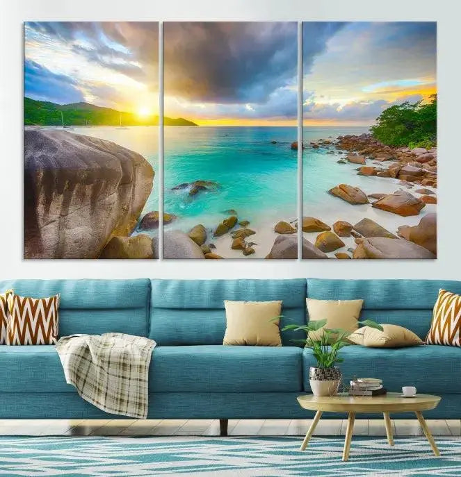 A triptych canvas of the Praslin Island Seychelles hangs on the wall. This vibrant beach sunset artwork features a UV-protective coating for lasting colors and comes with free shipping.