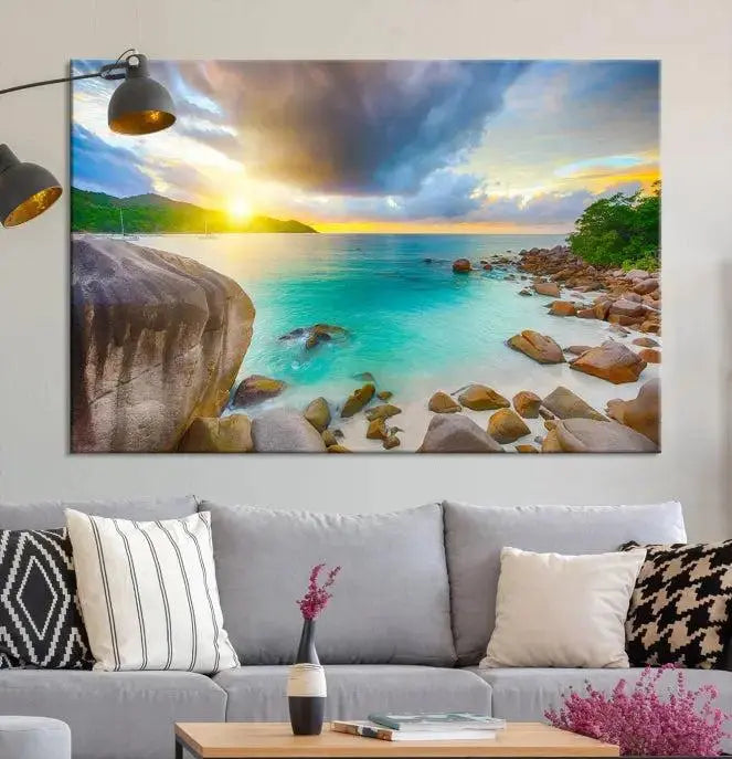 A triptych canvas of the Praslin Island Seychelles hangs on the wall. This vibrant beach sunset artwork features a UV-protective coating for lasting colors and comes with free shipping.