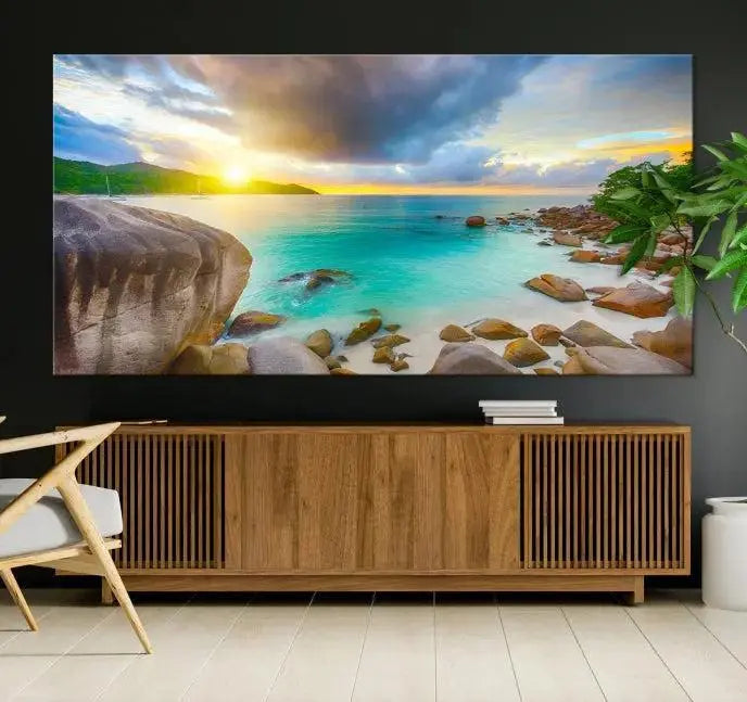 A triptych canvas of the Praslin Island Seychelles hangs on the wall. This vibrant beach sunset artwork features a UV-protective coating for lasting colors and comes with free shipping.