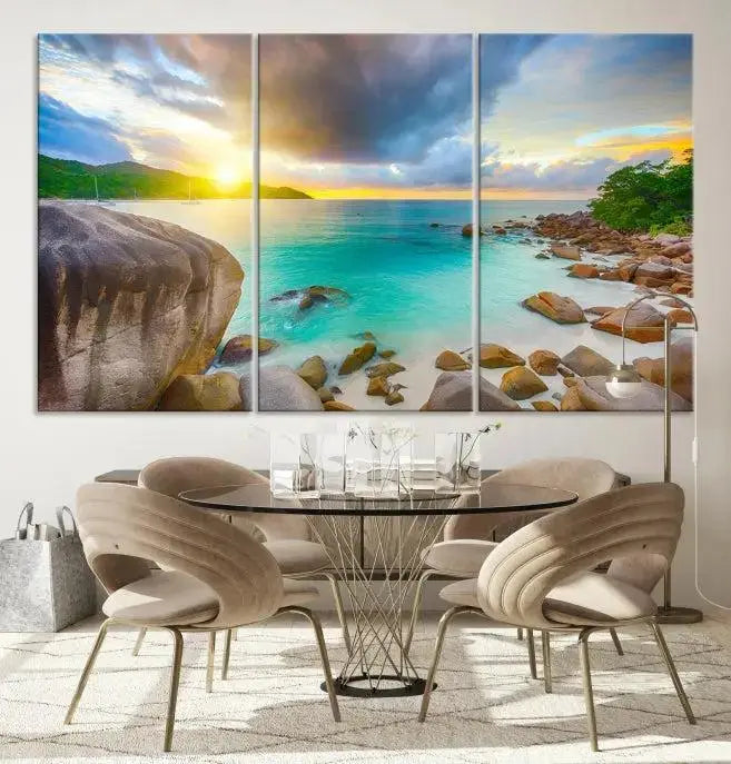 A triptych canvas of the Praslin Island Seychelles hangs on the wall. This vibrant beach sunset artwork features a UV-protective coating for lasting colors and comes with free shipping.