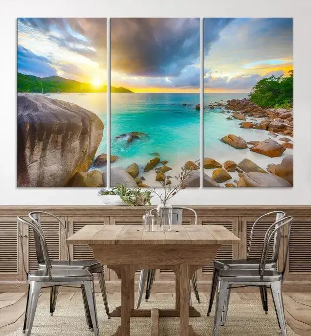 A triptych canvas of the Praslin Island Seychelles hangs on the wall. This vibrant beach sunset artwork features a UV-protective coating for lasting colors and comes with free shipping.