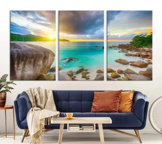 A triptych canvas of the Praslin Island Seychelles hangs on the wall. This vibrant beach sunset artwork features a UV-protective coating for lasting colors and comes with free shipping.