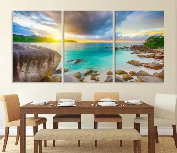 A triptych canvas of the Praslin Island Seychelles hangs on the wall. This vibrant beach sunset artwork features a UV-protective coating for lasting colors and comes with free shipping.