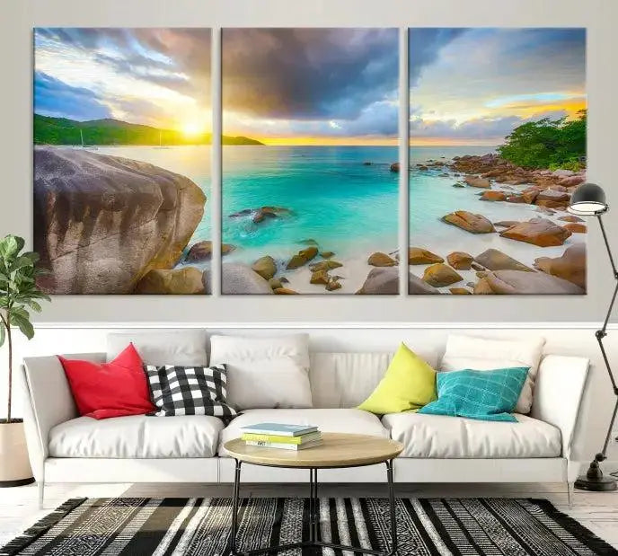 A triptych canvas of the Praslin Island Seychelles hangs on the wall. This vibrant beach sunset artwork features a UV-protective coating for lasting colors and comes with free shipping.