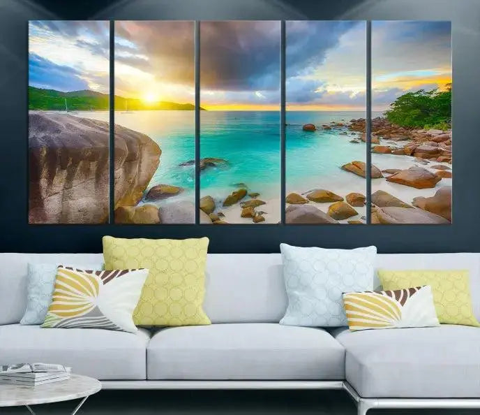 A triptych canvas of the Praslin Island Seychelles hangs on the wall. This vibrant beach sunset artwork features a UV-protective coating for lasting colors and comes with free shipping.