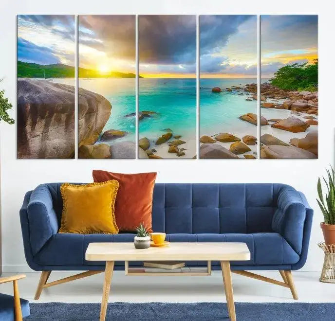 A triptych canvas of the Praslin Island Seychelles hangs on the wall. This vibrant beach sunset artwork features a UV-protective coating for lasting colors and comes with free shipping.