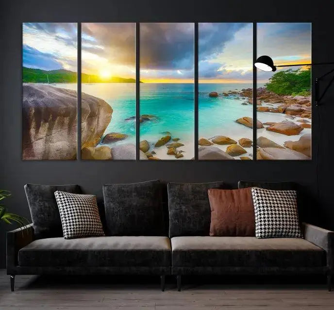 A triptych canvas of the Praslin Island Seychelles hangs on the wall. This vibrant beach sunset artwork features a UV-protective coating for lasting colors and comes with free shipping.