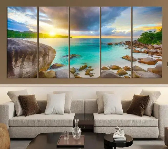 A triptych canvas of the Praslin Island Seychelles hangs on the wall. This vibrant beach sunset artwork features a UV-protective coating for lasting colors and comes with free shipping.