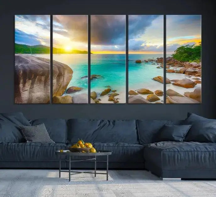 A triptych canvas of the Praslin Island Seychelles hangs on the wall. This vibrant beach sunset artwork features a UV-protective coating for lasting colors and comes with free shipping.