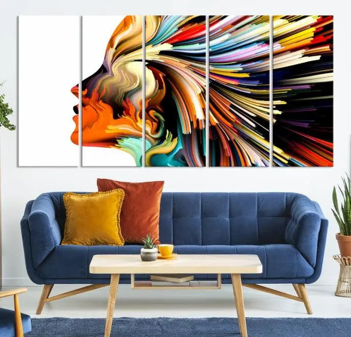 The "Profile Colors Canvas Print," featuring a colorful abstract face on museum-quality canvas, graces the wall.