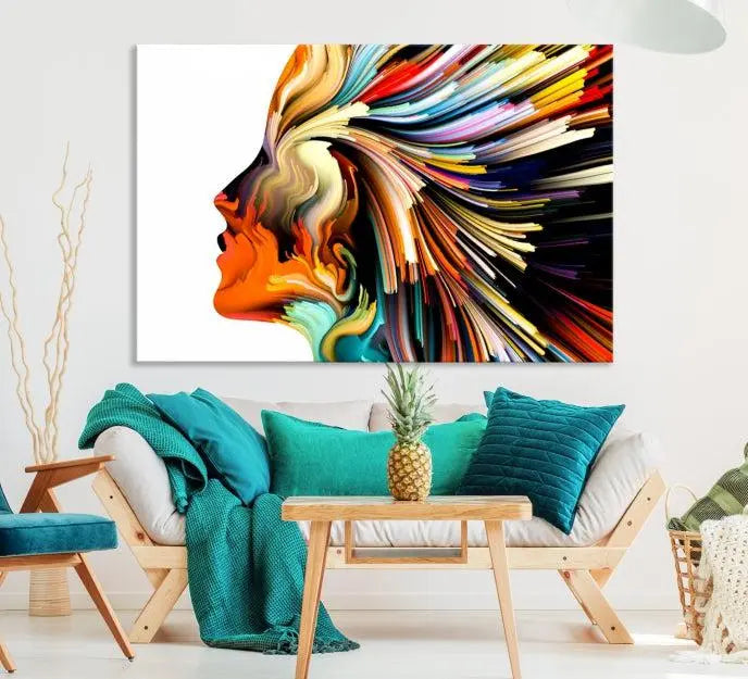 The "Profile Colors Canvas Print," featuring a colorful abstract face on museum-quality canvas, graces the wall.