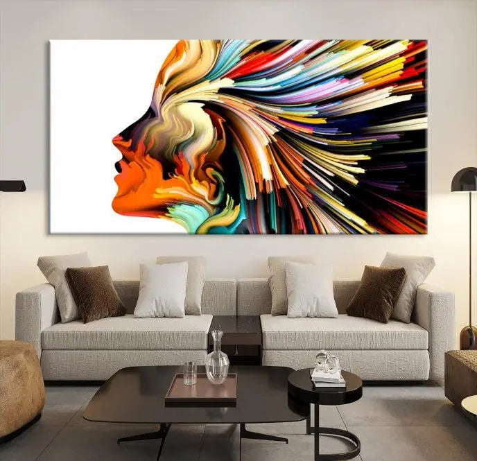 The "Profile Colors Canvas Print," featuring a colorful abstract face on museum-quality canvas, graces the wall.