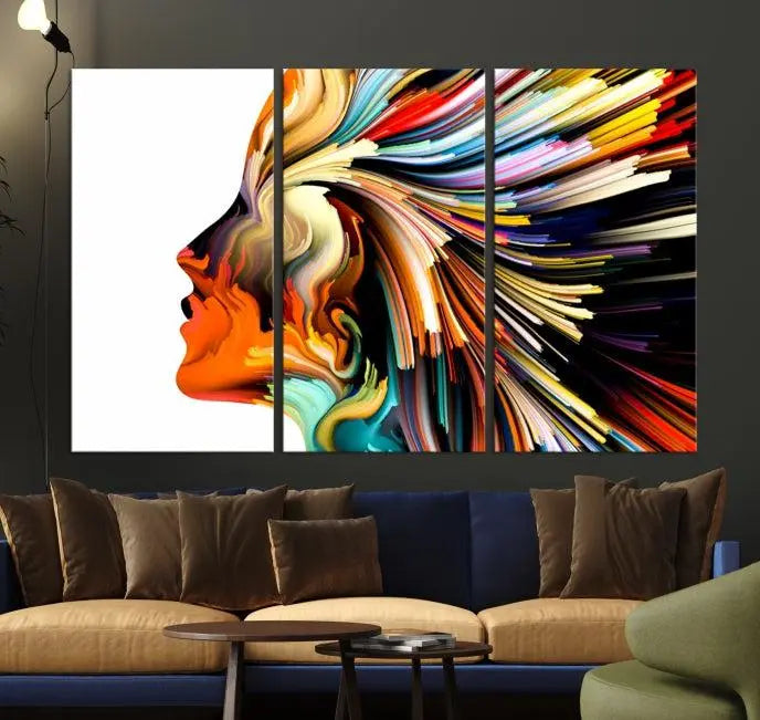 The "Profile Colors Canvas Print," featuring a colorful abstract face on museum-quality canvas, graces the wall.