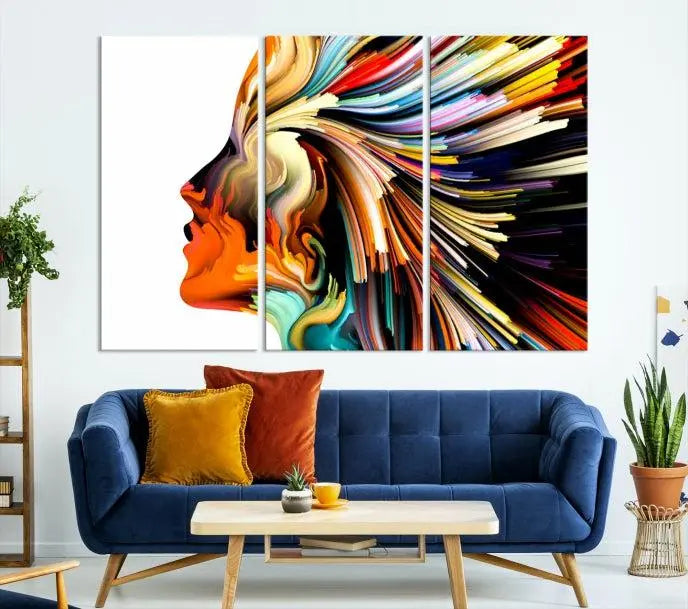 The "Profile Colors Canvas Print," featuring a colorful abstract face on museum-quality canvas, graces the wall.