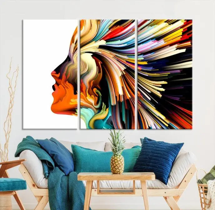 The "Profile Colors Canvas Print," featuring a colorful abstract face on museum-quality canvas, graces the wall.