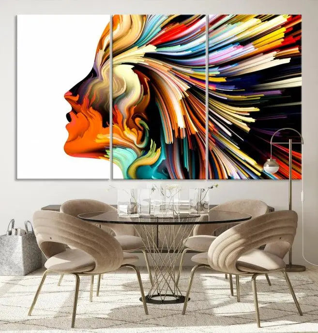 The "Profile Colors Canvas Print," featuring a colorful abstract face on museum-quality canvas, graces the wall.