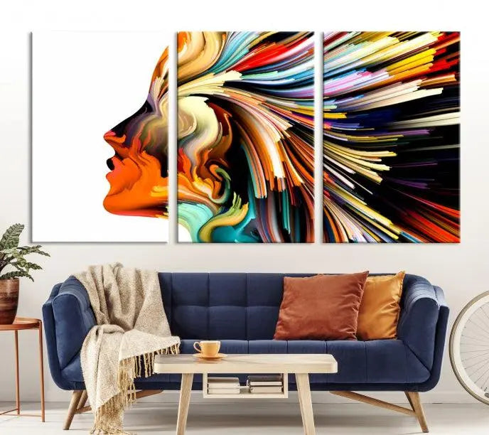 The "Profile Colors Canvas Print," featuring a colorful abstract face on museum-quality canvas, graces the wall.