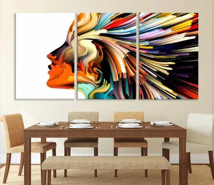 The "Profile Colors Canvas Print," featuring a colorful abstract face on museum-quality canvas, graces the wall.