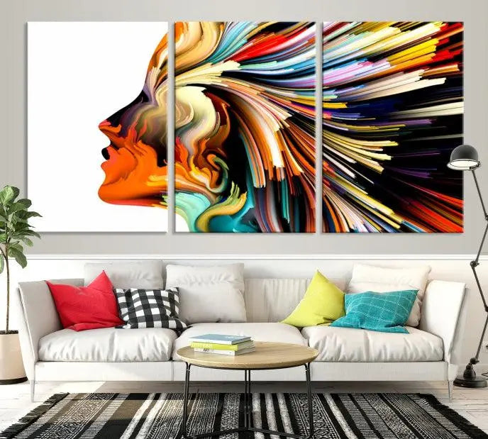 The "Profile Colors Canvas Print," featuring a colorful abstract face on museum-quality canvas, graces the wall.