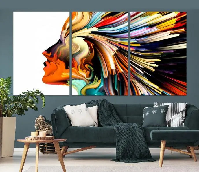 The "Profile Colors Canvas Print," featuring a colorful abstract face on museum-quality canvas, graces the wall.