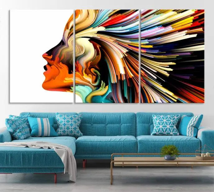 The "Profile Colors Canvas Print," featuring a colorful abstract face on museum-quality canvas, graces the wall.