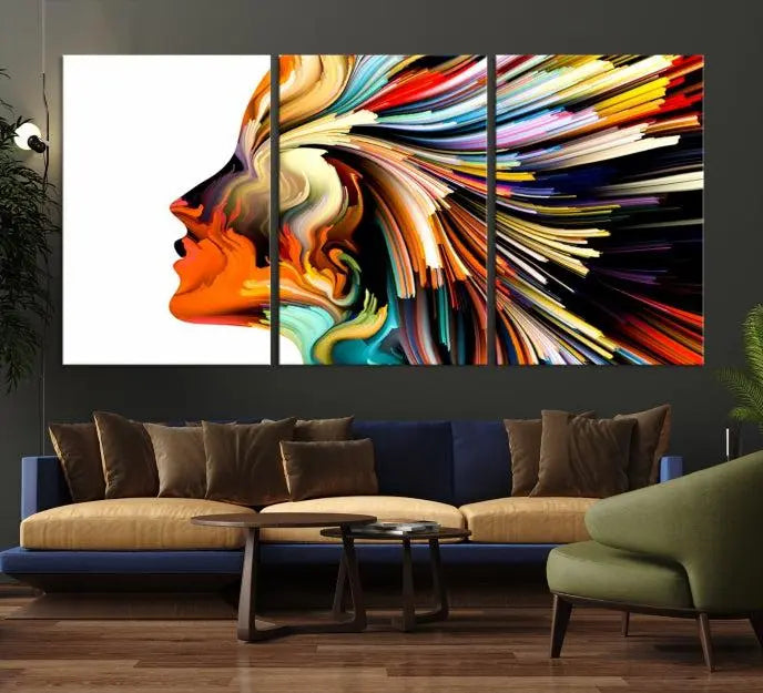 The "Profile Colors Canvas Print," featuring a colorful abstract face on museum-quality canvas, graces the wall.