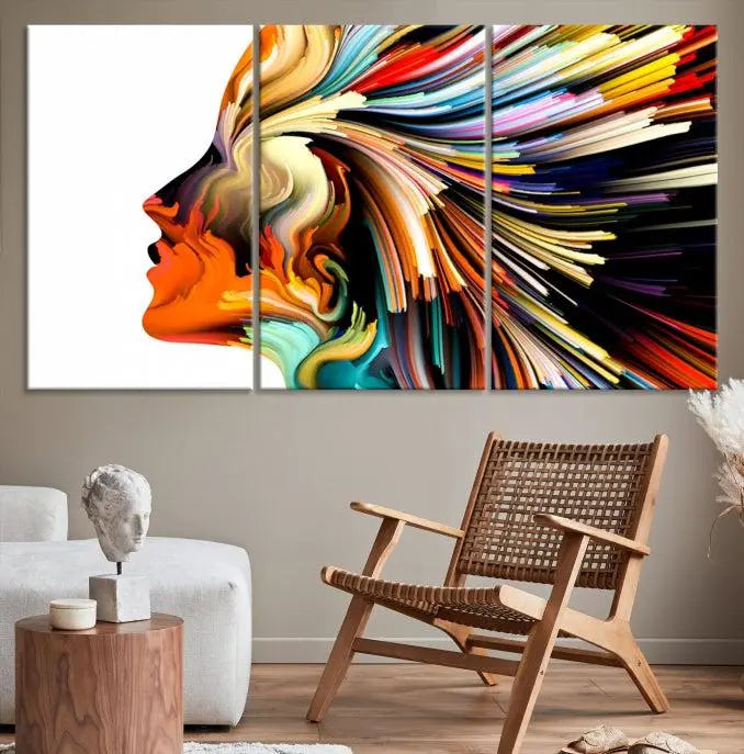 The "Profile Colors Canvas Print," featuring a colorful abstract face on museum-quality canvas, graces the wall.